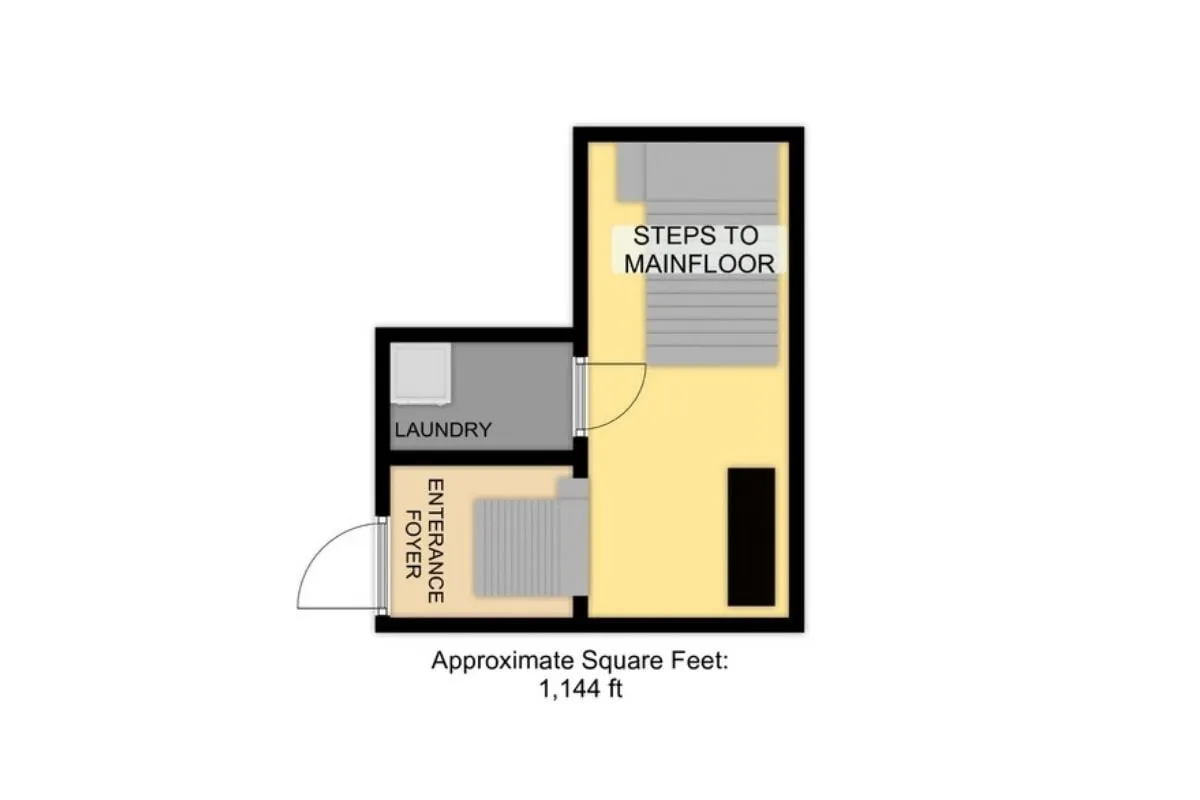 A welcoming entrance foyer featuring the laundry area and stairs leading up to the main living spaces. Natural light filters in, and a stacked washer and dryer are visible, emphasizing practicality right at the entryway.