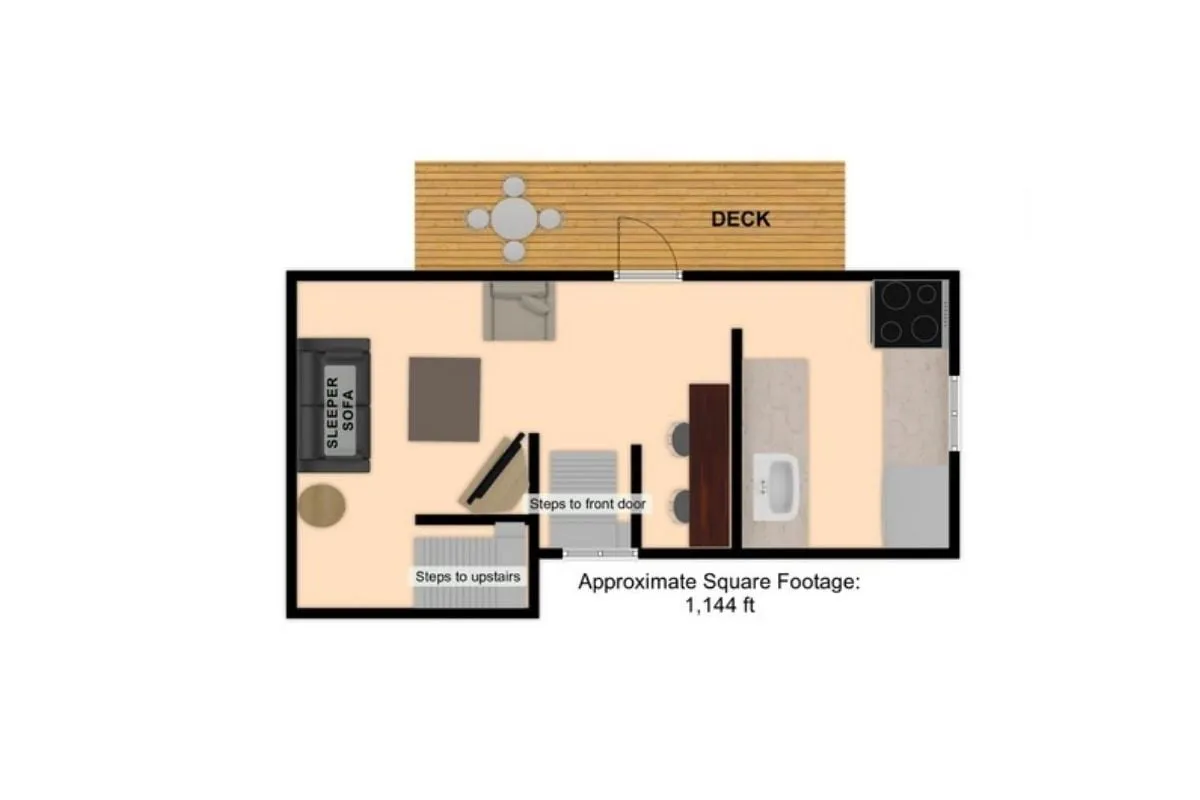 An interior view that captures the connection between the living area and the adjacent private deck. Visible are a sleeper sofa, the deck area through sliding doors, and a glimpse of the kitchen, creating a sense of flow between spaces.
